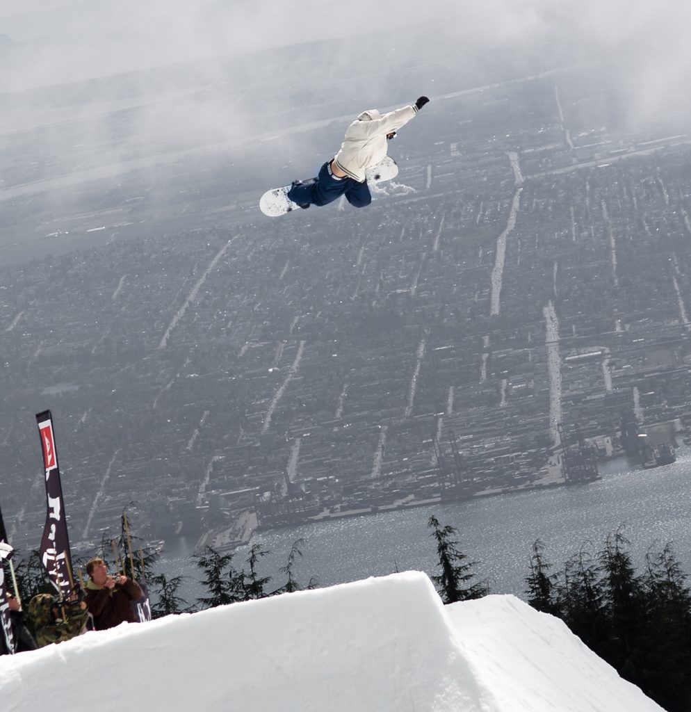 Snowboarder Flying over Quick Silver Showdown at Grouse Mountain