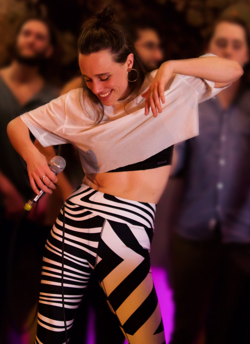 Singer wearing zebra pattern leggings