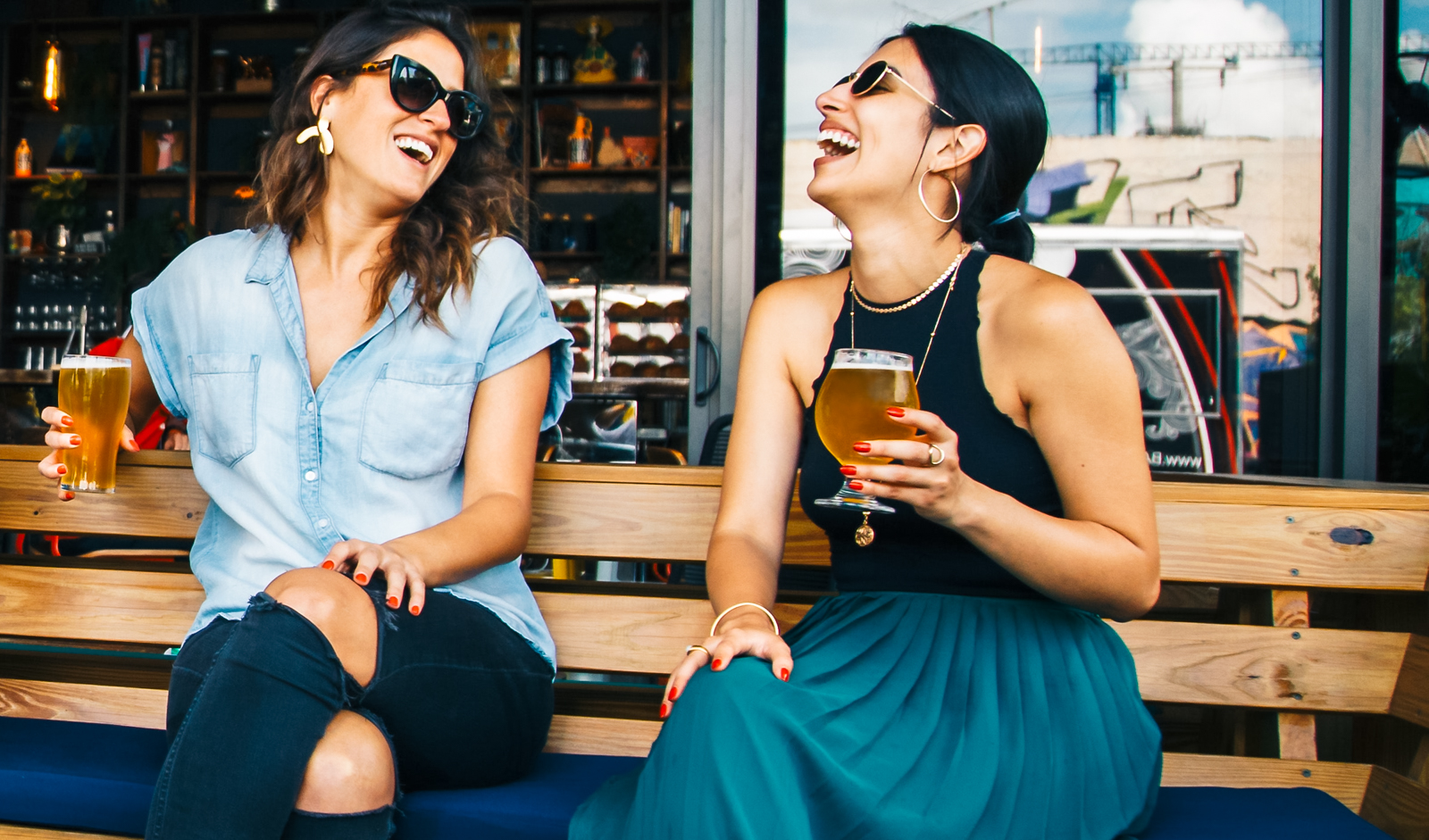 Couple Women Drinking Cider at a Patio